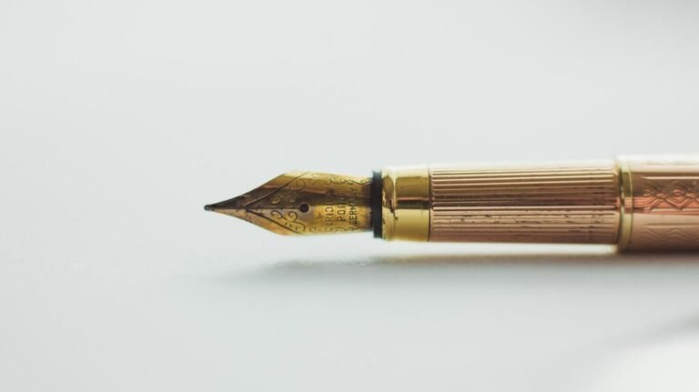 A fountain pen laying on its side.