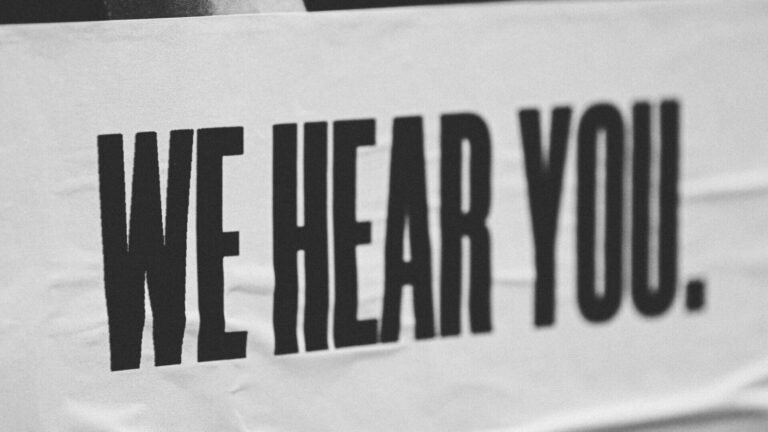 A sign that says 'We Hear You'.